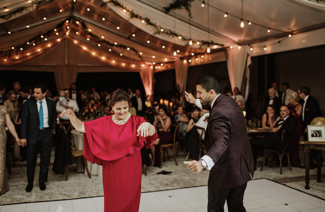 A unique Vizcaya Museum Wedding in Miami The Creatives Loft Weddings Miami groom dancing with mom