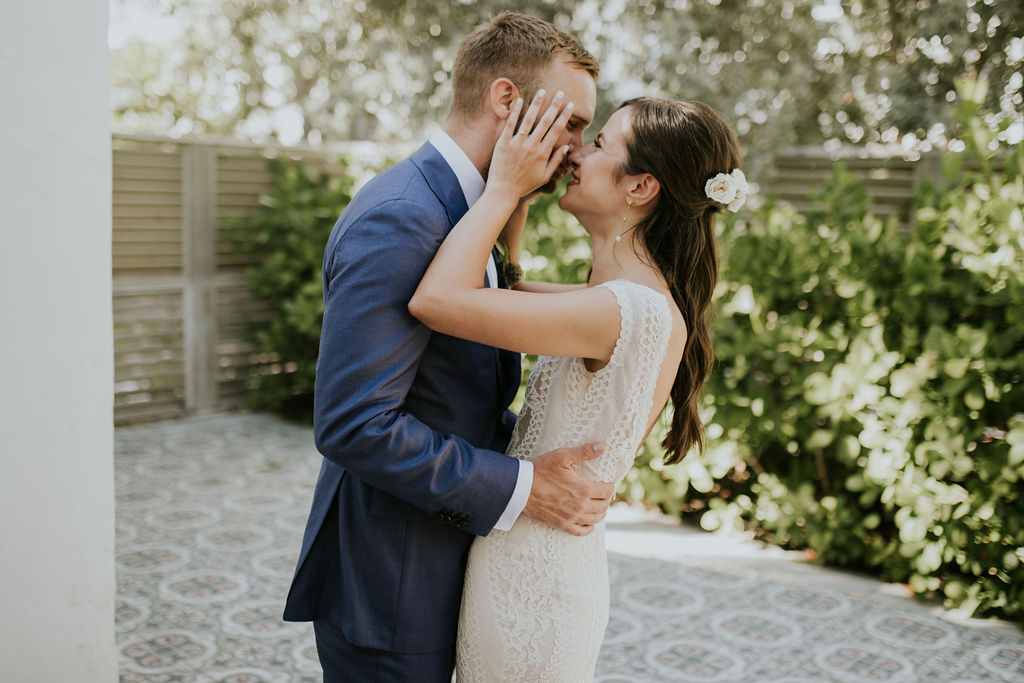 Bride and groom kissing during first look