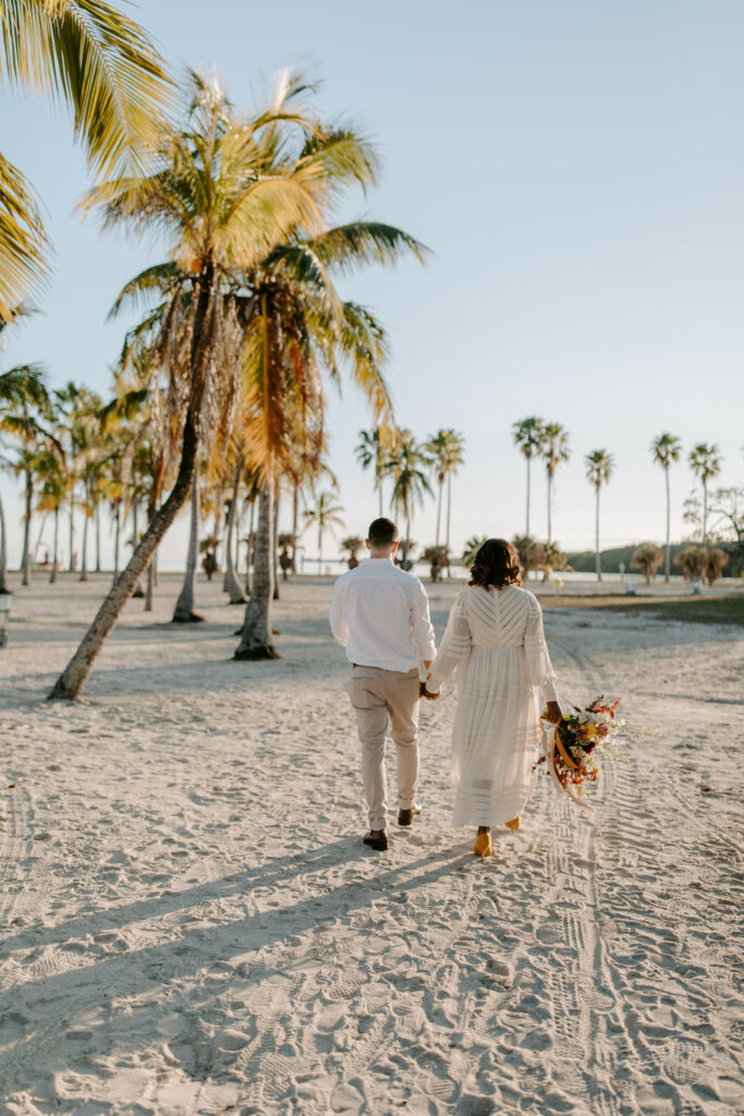 Miami Bohemian Elopement Wedding The Creative's Loft Couple Walking at the beach