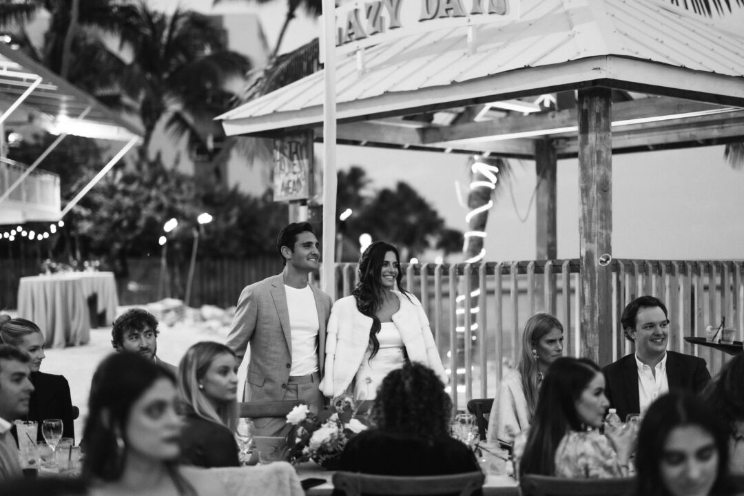 Couple looking at the mother of the groom