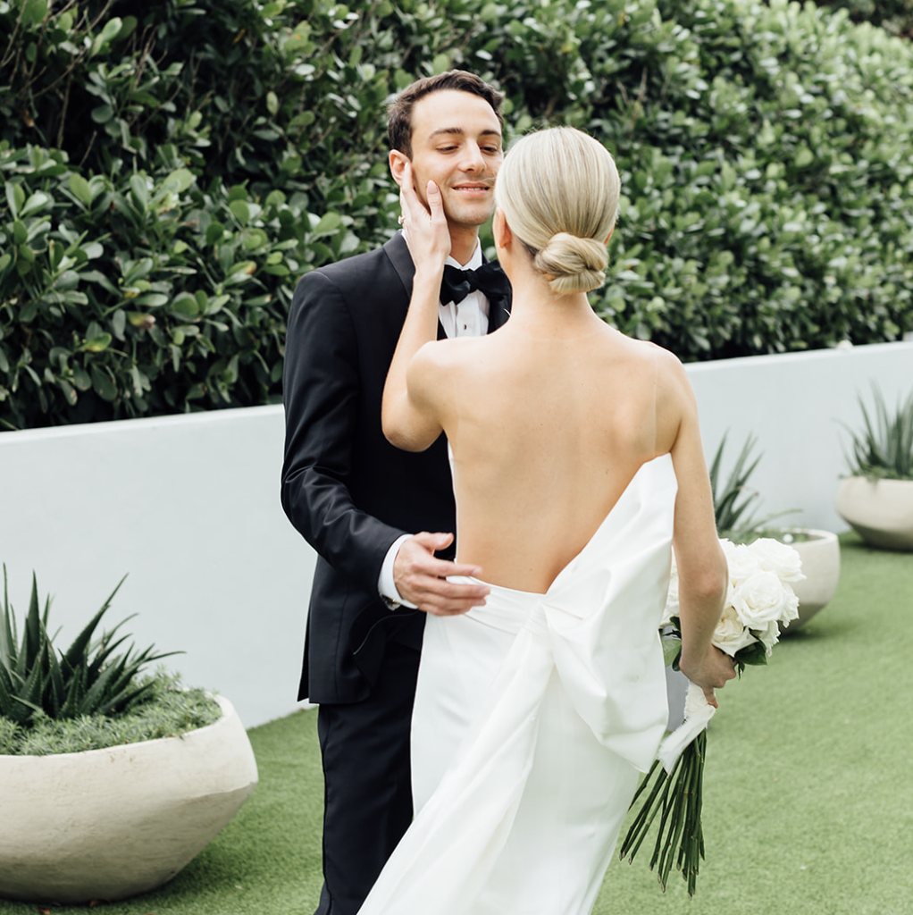 Bride caresing the groom