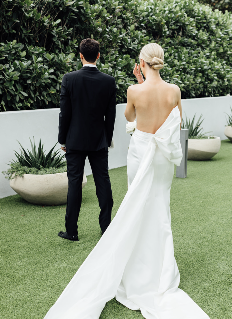 The couple about to see each other during First Look