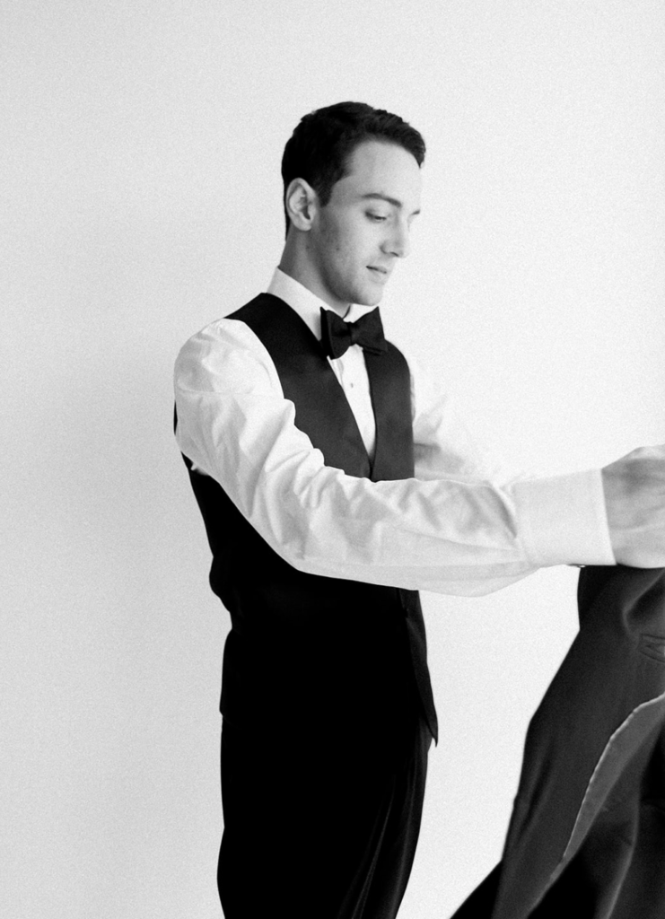 groom getting dress in his room