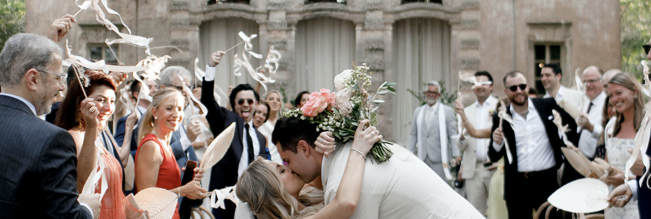 The bride and groom kissing after their ceremony at Vizcaya Museum.